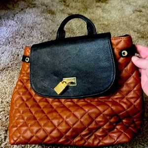 Steve Madden backpack brown with black and gold  accents! Perfect for fall! 🎒